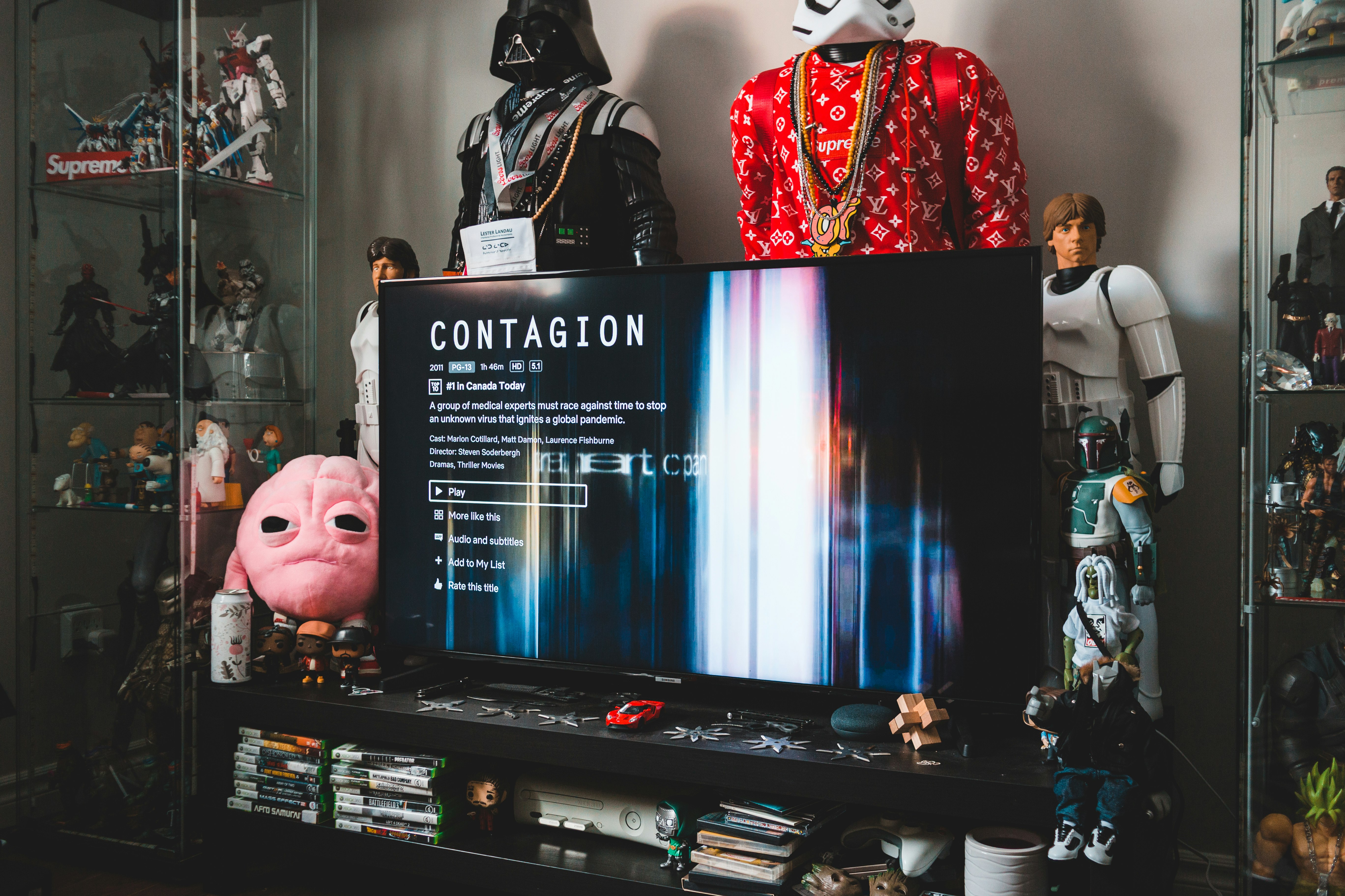 black flat screen tv turned on displaying man in black suit